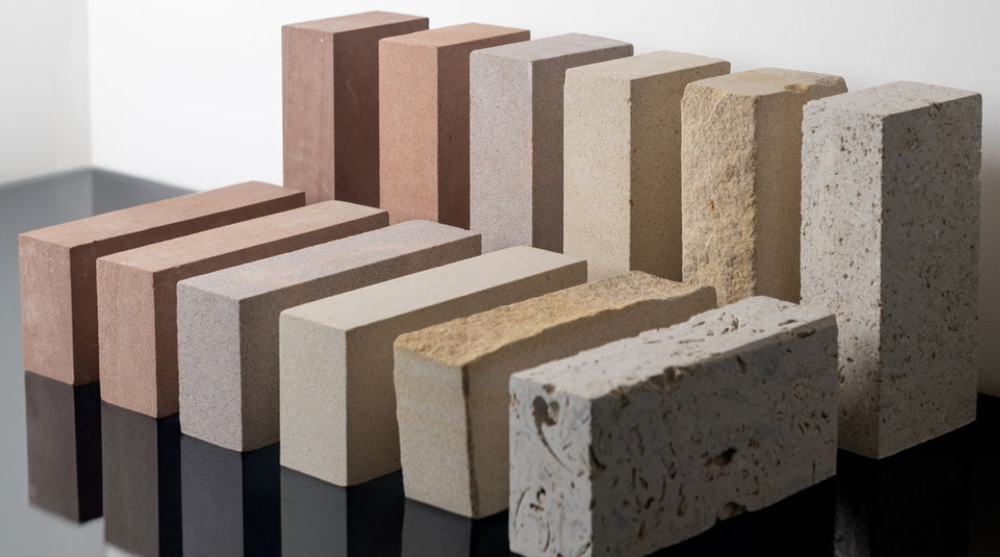 Stone bricks in multiple colours, laid horizontally and vertically.